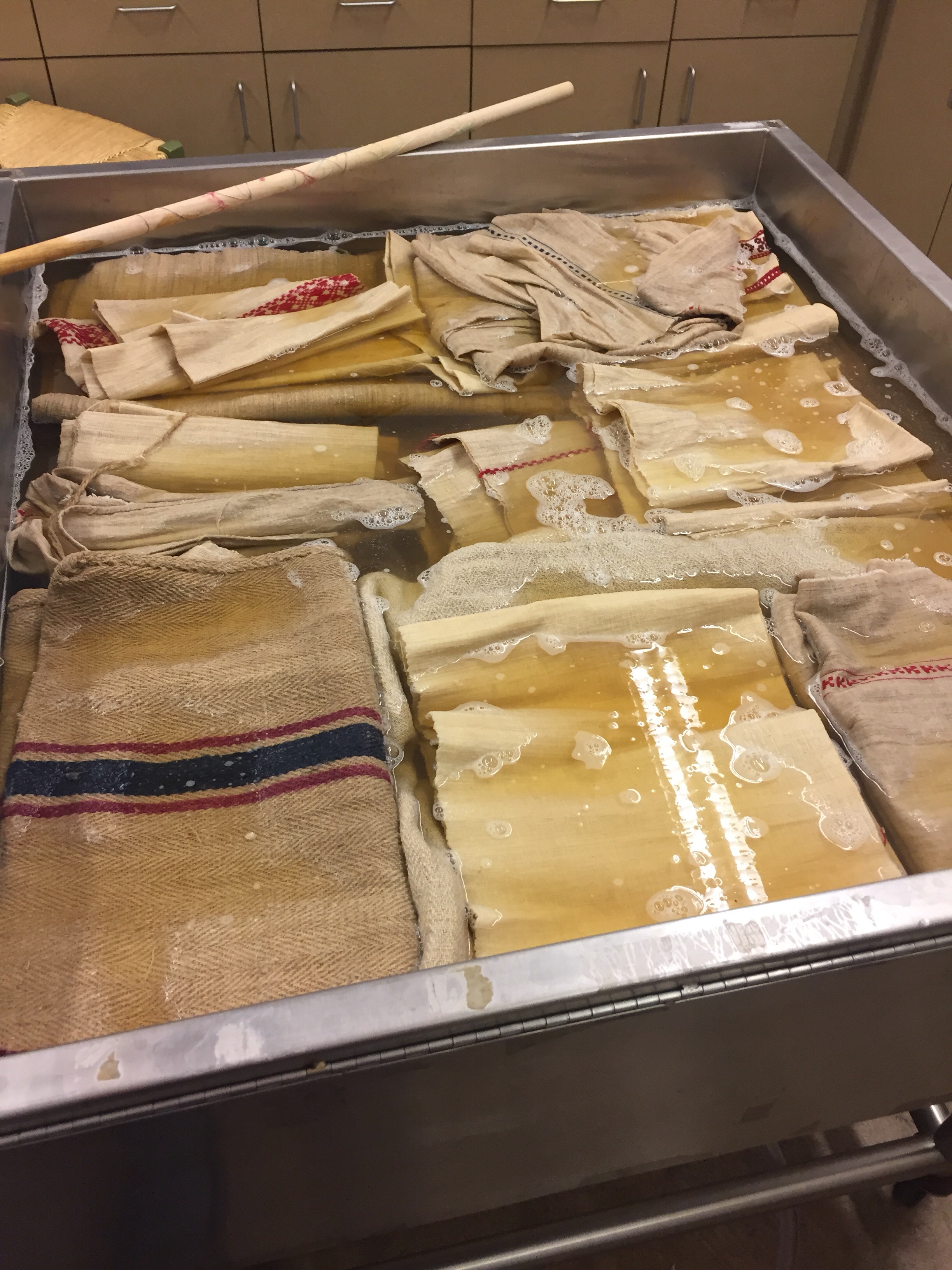 Grain sacks and antique toweling first soaking in cleaning solution.