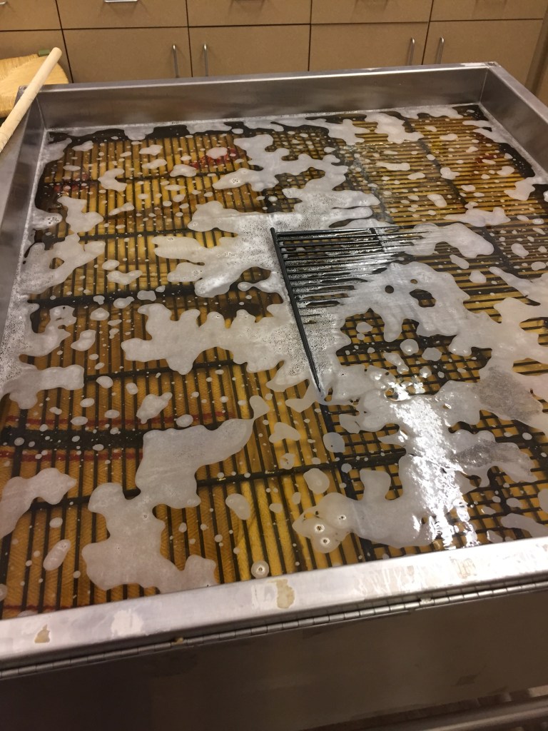 Antique grain sacks and linen flax and hemp textiles submerged for cleaning